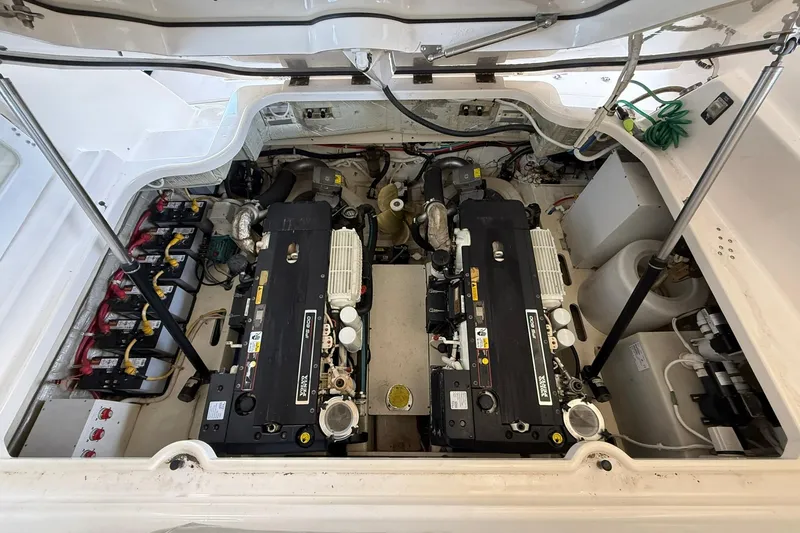 Slide: The Image of Engine compartment of 2011 Tiara Yachts 4500 Sovran, showcasing dual engines and battery setup. - 80