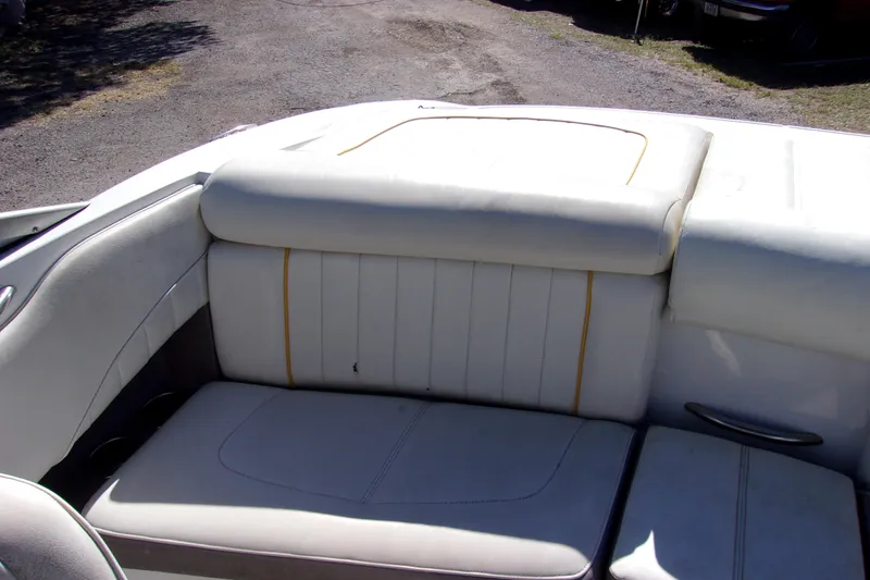 Slide: The Image of White leather seating in a 2005 Cobalt 200 boat, outdoor setting. - 10