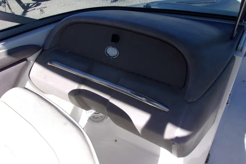 Slide: The Image of Interior of a 2005 Cobalt 200 boat, featuring dashboard and seating area. - 7