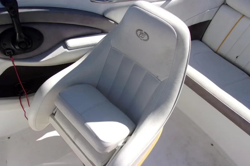 Slide: The Image of White leather seat in a 2005 Cobalt 200 boat interior. - 8
