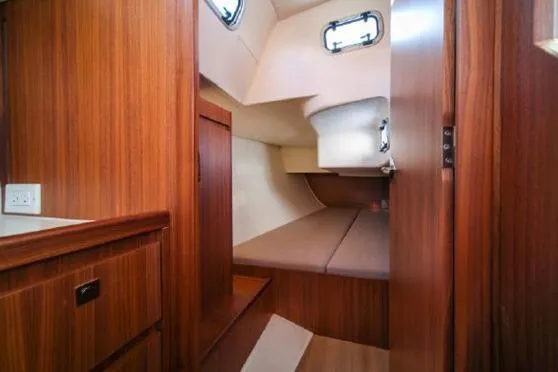 Slide: The Image of 2021 J Boats J/112E cabin interior with wood finish and cozy sleeping area. - 10