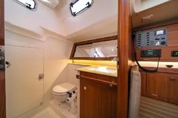 Slide: The Image of 2021 J Boats J/112E yacht interior with modern bathroom and control panel. - 12