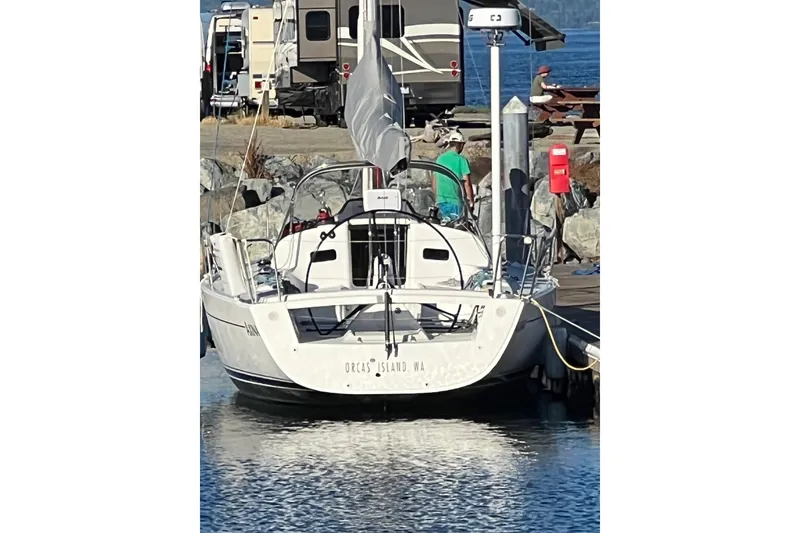 Slide: The Image of 2021 J Boats J/112E docked at Orcas Island marina, with RVs in the background. - 15