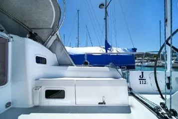 Slide: The Image of 2021 J Boats J/112E sailboat docked in a marina under clear blue skies. - 20
