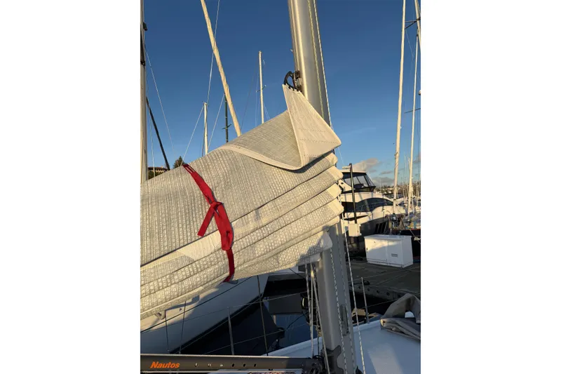 Slide: The Image of Folded sail on a 2021 J Boats J/112E yacht, docked in a marina. - 22