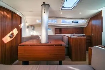 Slide: The Image of Interior of 2021 J Boats J/112E sailboat with wood finish and skylight. - 7