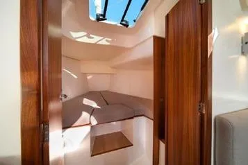 Slide: The Image of 2021 J Boats J/112E cabin interior with wooden finish and skylight. - 8
