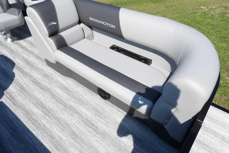 Slide: The Image of 2026 Bennington S Quad Bench 22 SSR with sleek gray upholstery on a boat deck. - 12