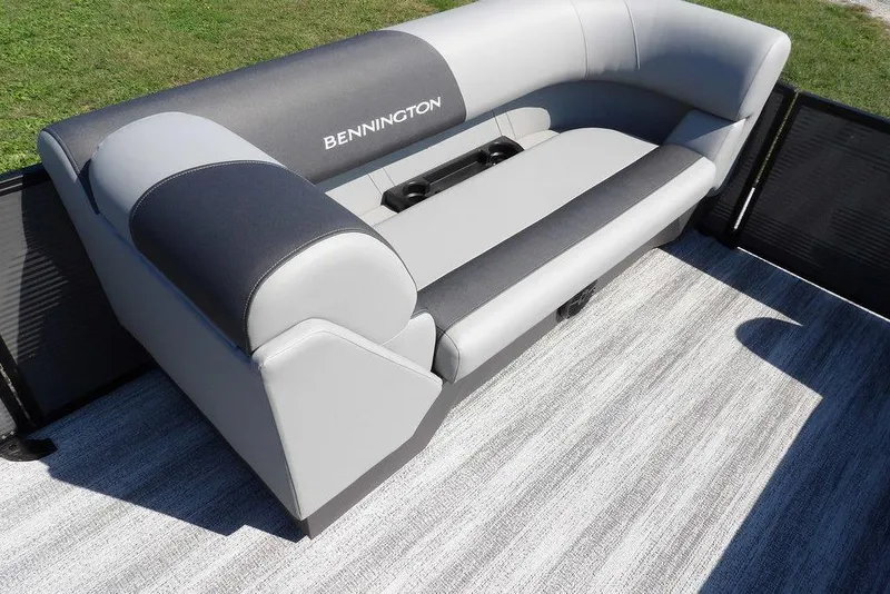 Slide: The Image of 2026 Bennington S Quad Bench 22 SSR with gray and black seating on a boat deck. - 13