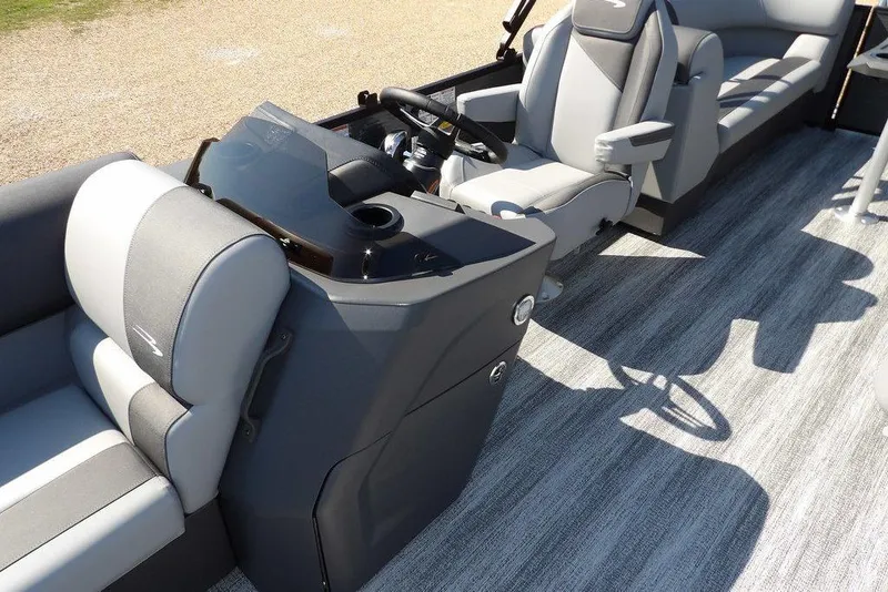 Slide: The Image of 2026 Bennington S Quad Bench 22 SSR interior with modern seating and steering console. - 21