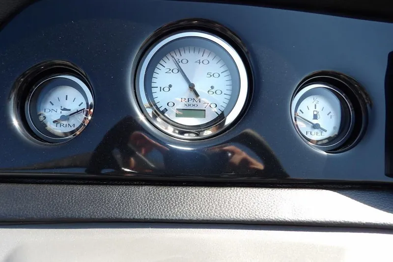 Slide: The Image of Dashboard gauges of 2026 Bennington S Quad Bench 22 SSR, showing RPM, trim, and fuel levels. - 24