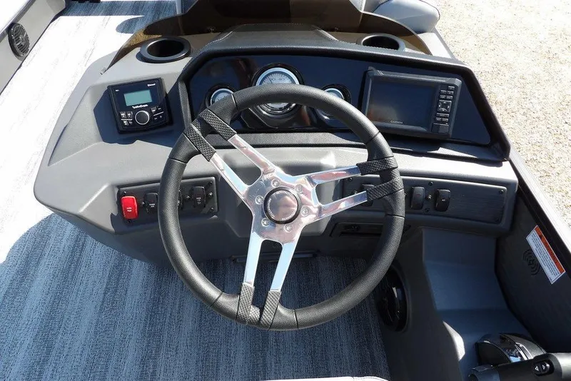 Slide: The Image of Steering console of 2026 Bennington S Quad Bench 22 SSR with modern controls and displays. - 27