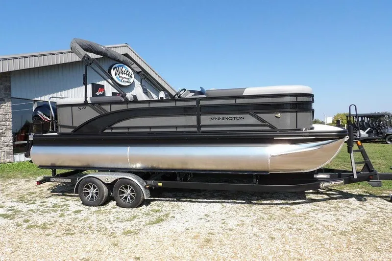 Slide: The Image of 2026 Bennington S Quad Bench 22 SSR pontoon boat on trailer at White's Marine Center. - 3