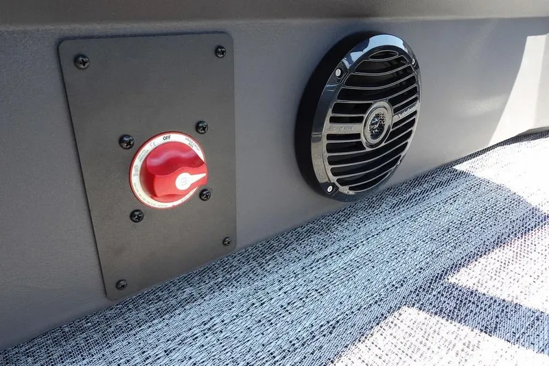 Slide: The Image of 2026 Bennington S Quad Bench 22 SSR interior with speaker and control switch. - 32