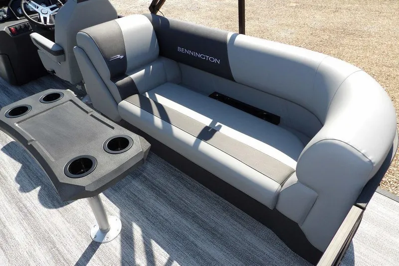 Slide: The Image of 2026 Bennington S Quad Bench 22 SSR with gray seating and cupholder table. - 35