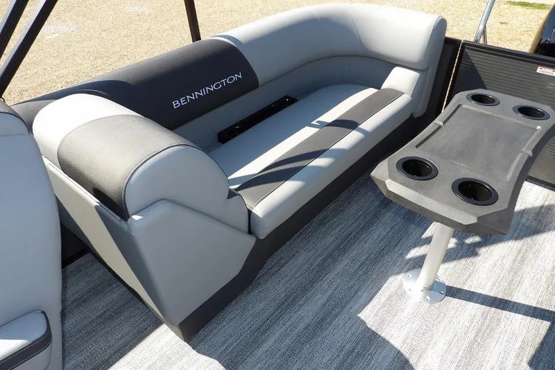 Slide: The Image of 2026 Bennington S Quad Bench 22 SSR interior with seating and table. - 36