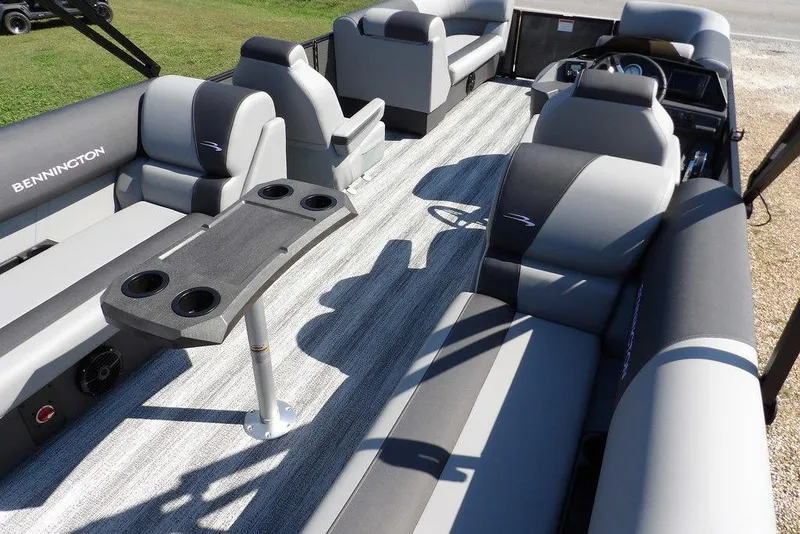 Slide: The Image of 2026 Bennington S Quad Bench 22 SSR pontoon boat interior with seating and table. - 39