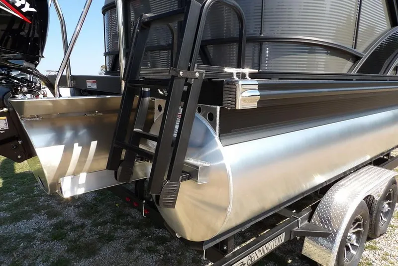 Slide: The Image of 2026 Bennington S Quad Bench 22 SSR pontoon boat with ladder and motor detail. - 46