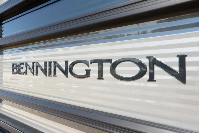 Slide: The Image of Bennington logo on 2026 S Quad Bench 22 SSR boat exterior. - 50