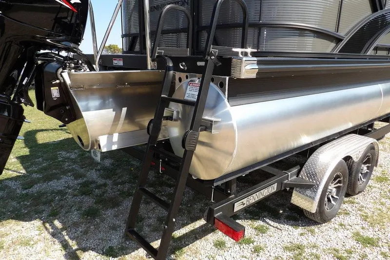 Slide: The Image of 2026 Bennington S Quad Bench 22 SSR pontoon boat on trailer, rear view. - 52