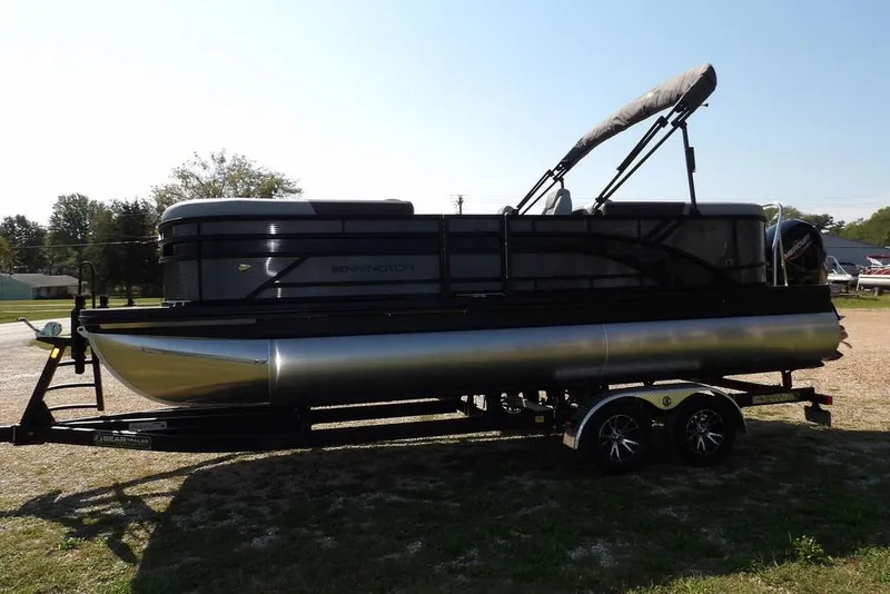 Slide: The Image of 2026 Bennington S Quad Bench 22 SSR pontoon boat on trailer, side view. - 6