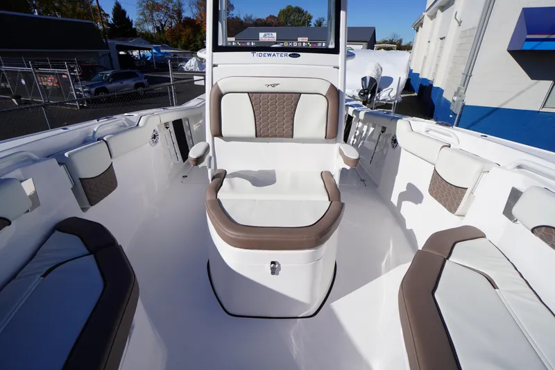 Slide: The Image of 2026 Tidewater 256 CC Adventure boat storage compartment with secure latch and sleek design. - 18