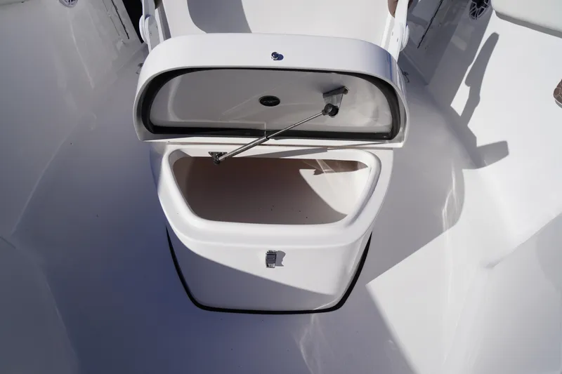 Slide: The Image of 2026 Tidewater 256 CC Adventure boat interior with cushioned seating and modern design. - 20
