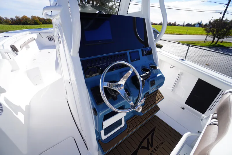 Slide: The Image of Interior of 2026 Tidewater 256 CC Adventure boat, featuring modern equipment and fixtures. - 27