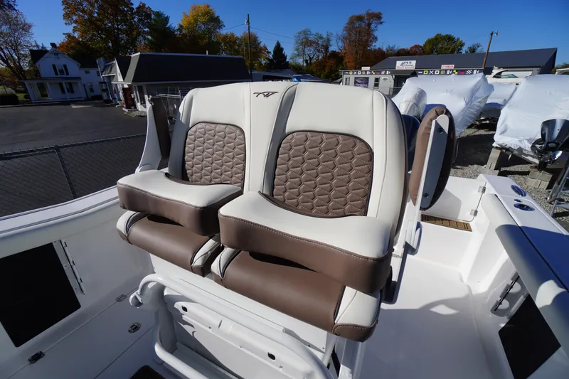 Slide: The Image of Luxury seating on 2026 Tidewater 256 CC Adventure boat, featuring premium upholstery and armrests. - 35