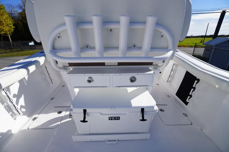 Slide: The Image of 2026 Tidewater 256 CC Adventure boat interior with dual seats and steering console. - 37