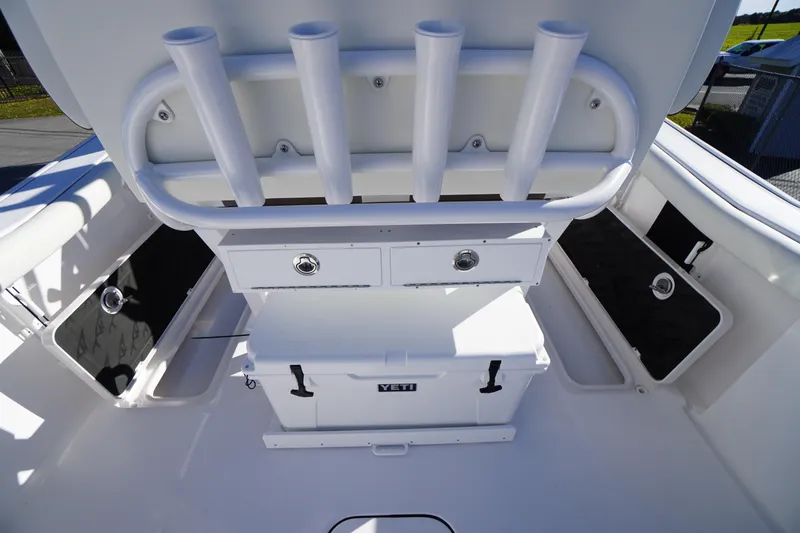 Slide: The Image of 2026 Tidewater 256 CC Adventure boat with Yeti cooler on deck. - 41