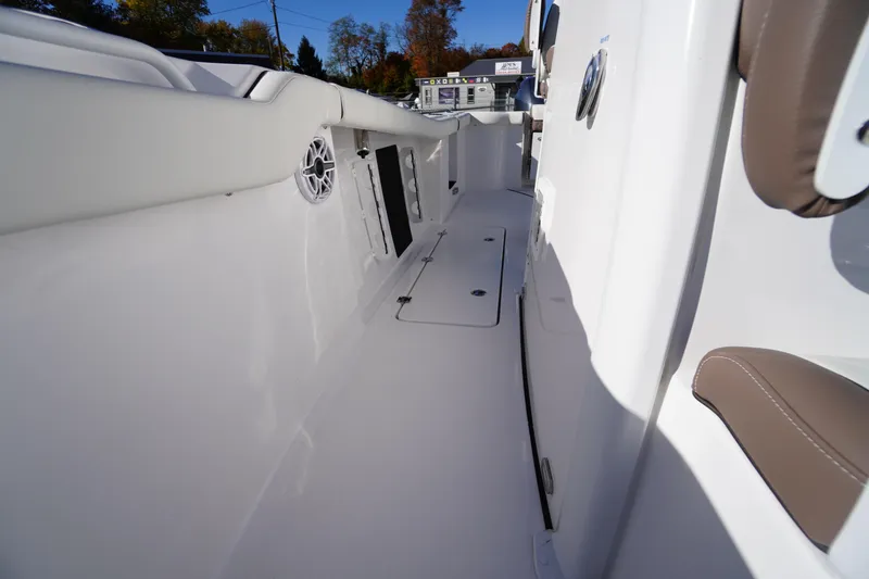Slide: The Image of Open storage compartment on 2026 Tidewater 256 CC Adventure boat deck. - 43
