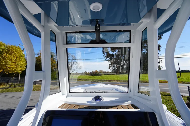 Slide: The Image of 2026 Tidewater 256 CC Adventure boat with sleek design at Jim's Marine dealership. - 47