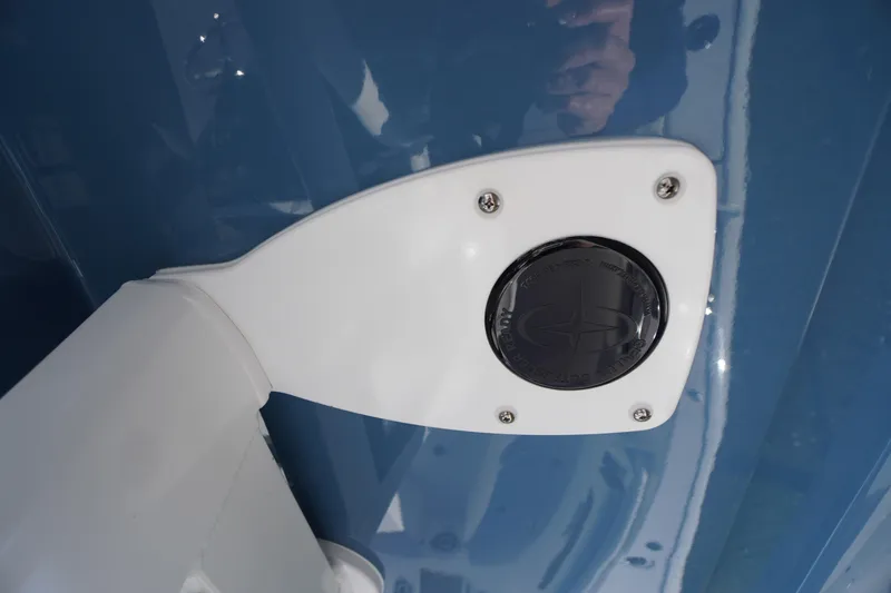 Slide: The Image of 2026 Tidewater 256 CC Adventure boat console with blue finish and control panel. - 50