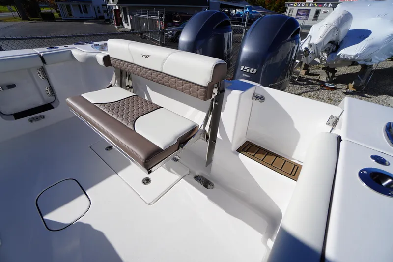 Slide: The Image of 2026 Tidewater 256 CC Adventure boat with open livewell and Yamaha engines. - 60