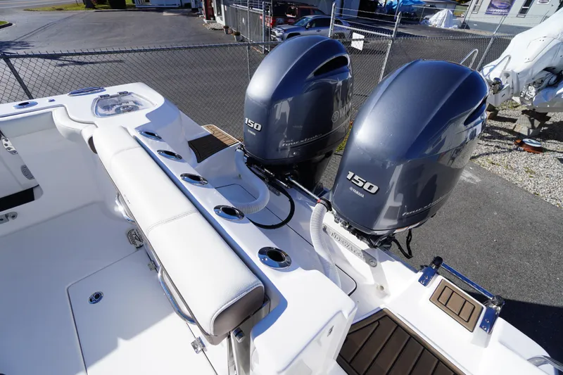 Slide: The Image of Tidewater 256 CC Adventure 2026 boat seat with stylish brown and white upholstery. - 64