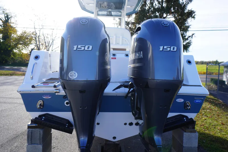 Slide: The Image of 2026 Tidewater 256 CC Adventure boat with Yamaha engine and ladder on blocks. - 71