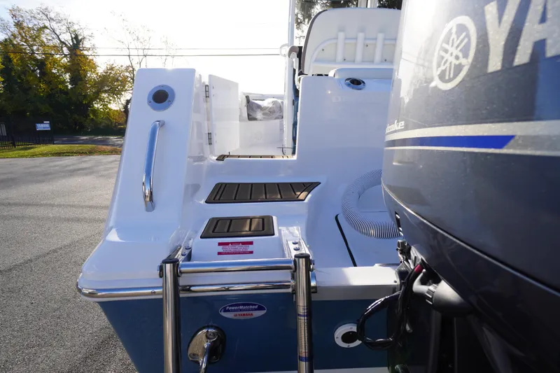 Slide: The Image of 2026 Tidewater 256 CC Adventure boat with dual Yamaha 150 outboard engines. - 73