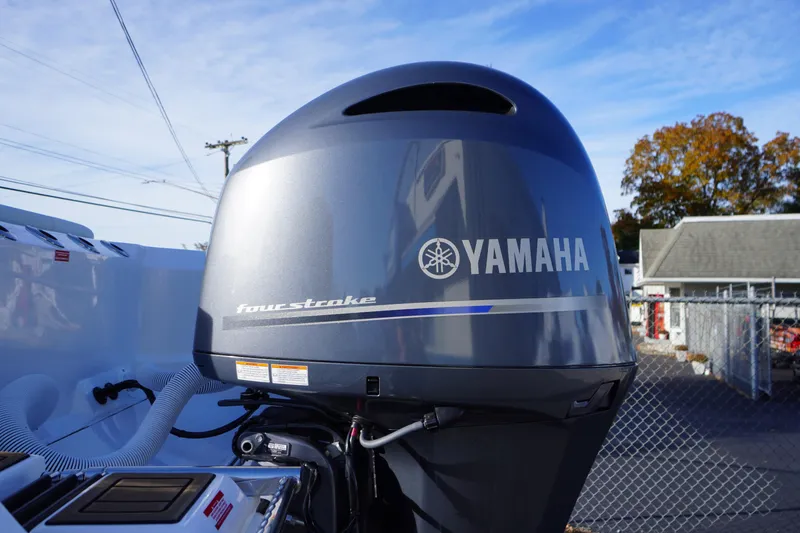 Slide: The Image of 2026 Tidewater 256 CC Adventure boat with dual Yamaha outboard engines. - 77