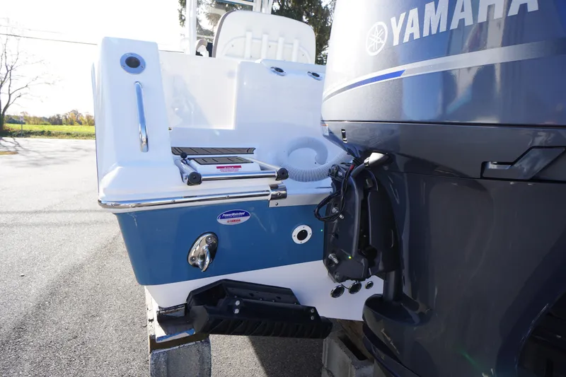 Slide: The Image of Yamaha four-stroke engine on 2026 Tidewater 256 CC Adventure boat, outdoor setting. - 78