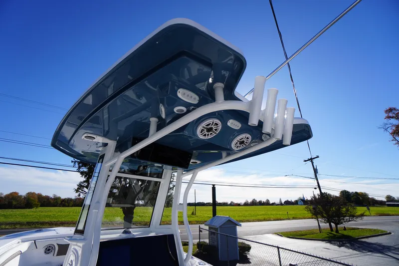 Slide: The Image of 2026 Tidewater 256 CC Adventure boat with Yamaha engine, rear view. - 79