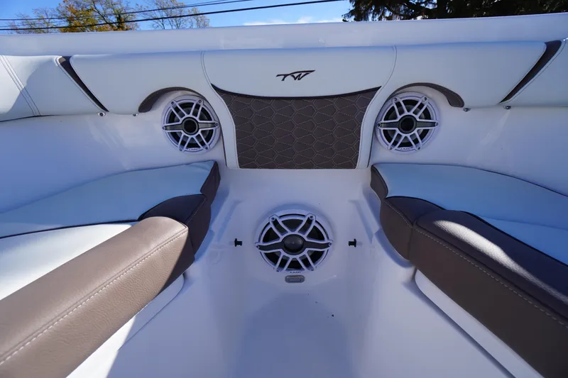 Slide: The Image of 2026 Tidewater 256 CC Adventure boat interior with cushioned seating and built-in speakers. - 9