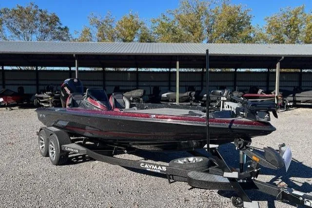 The Image of 2026 Caymas CX 20 PRO bass boat on trailer, parked outdoors. - 1