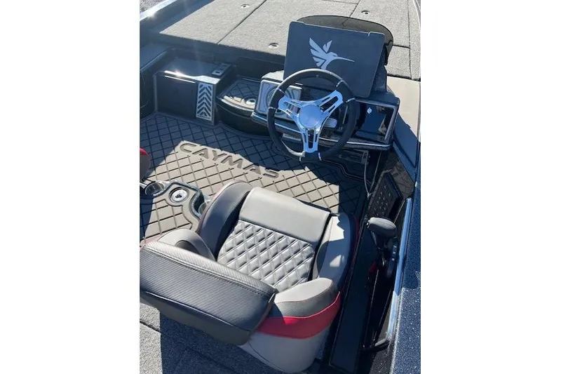 Slide: The Image of 2026 Caymas CX 20 PRO boat interior with steering wheel and cushioned seat. - 5