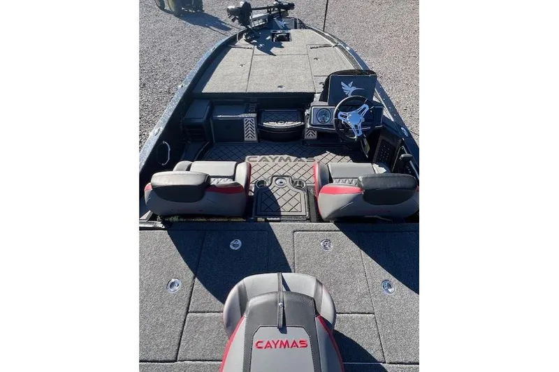 Slide: The Image of 2026 Caymas CX 20 PRO boat interior with steering wheel and seating. - 7