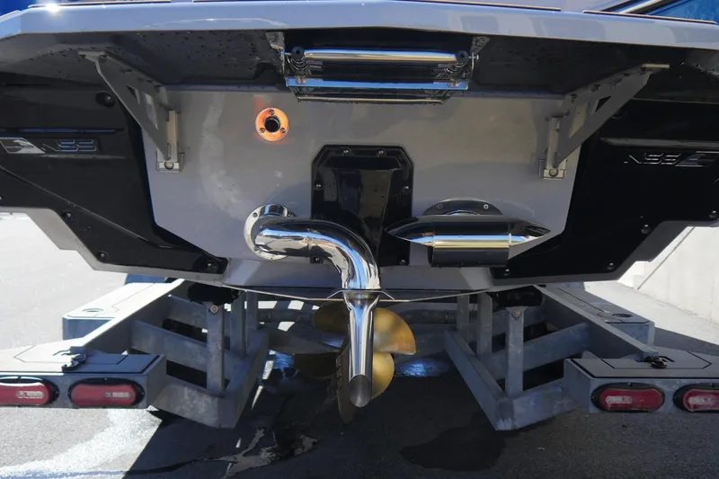 Slide: The Image of 2026 Nautique Super Air Nautique G23 boat stern with propeller and exhaust system. - 20