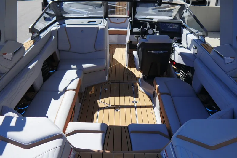 Slide: The Image of 2026 Nautique Super Air Nautique G23 interior with luxurious seating and modern dashboard. - 22