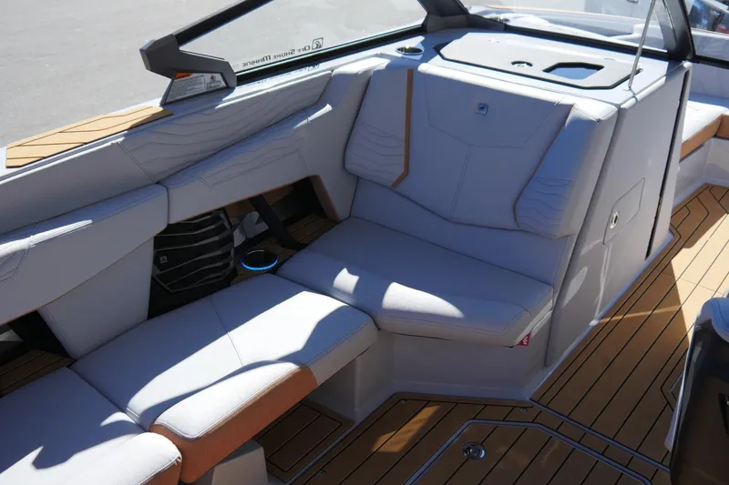 Slide: The Image of 2026 Nautique Super Air Nautique G23 interior with luxurious seating and modern design. - 23