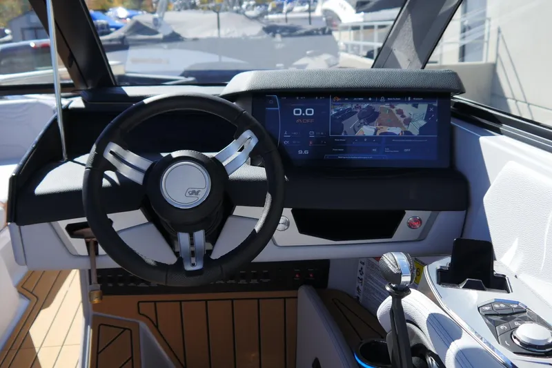 Slide: The Image of 2026 Nautique Super Air Nautique G23 dashboard with steering wheel and digital display. - 26