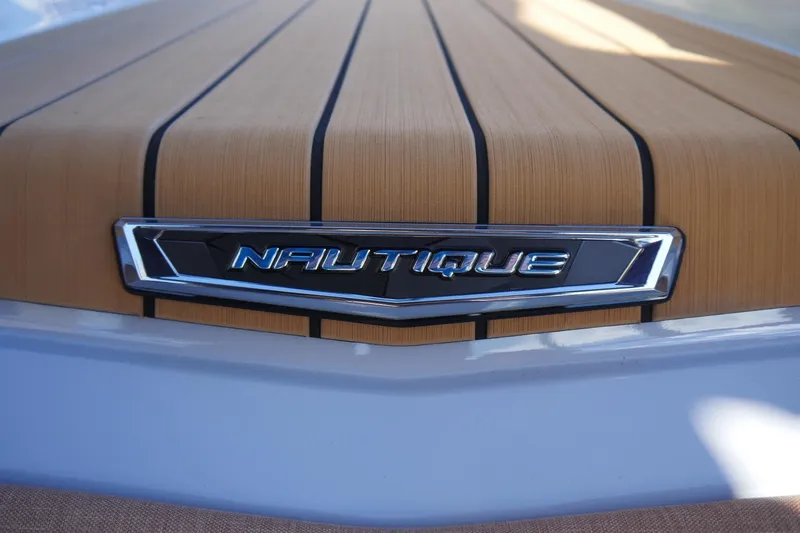 Slide: The Image of 2026 Nautique Super Air Nautique G23 boat deck with logo detail. - 30